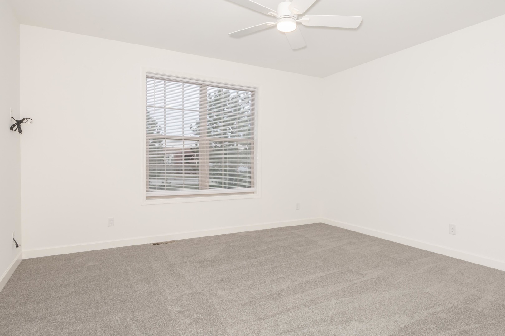 1334 Monterey Pine Drive, Unit 1334 Normal, IL 61761 - Photo 23 of 51 an empty room with a window