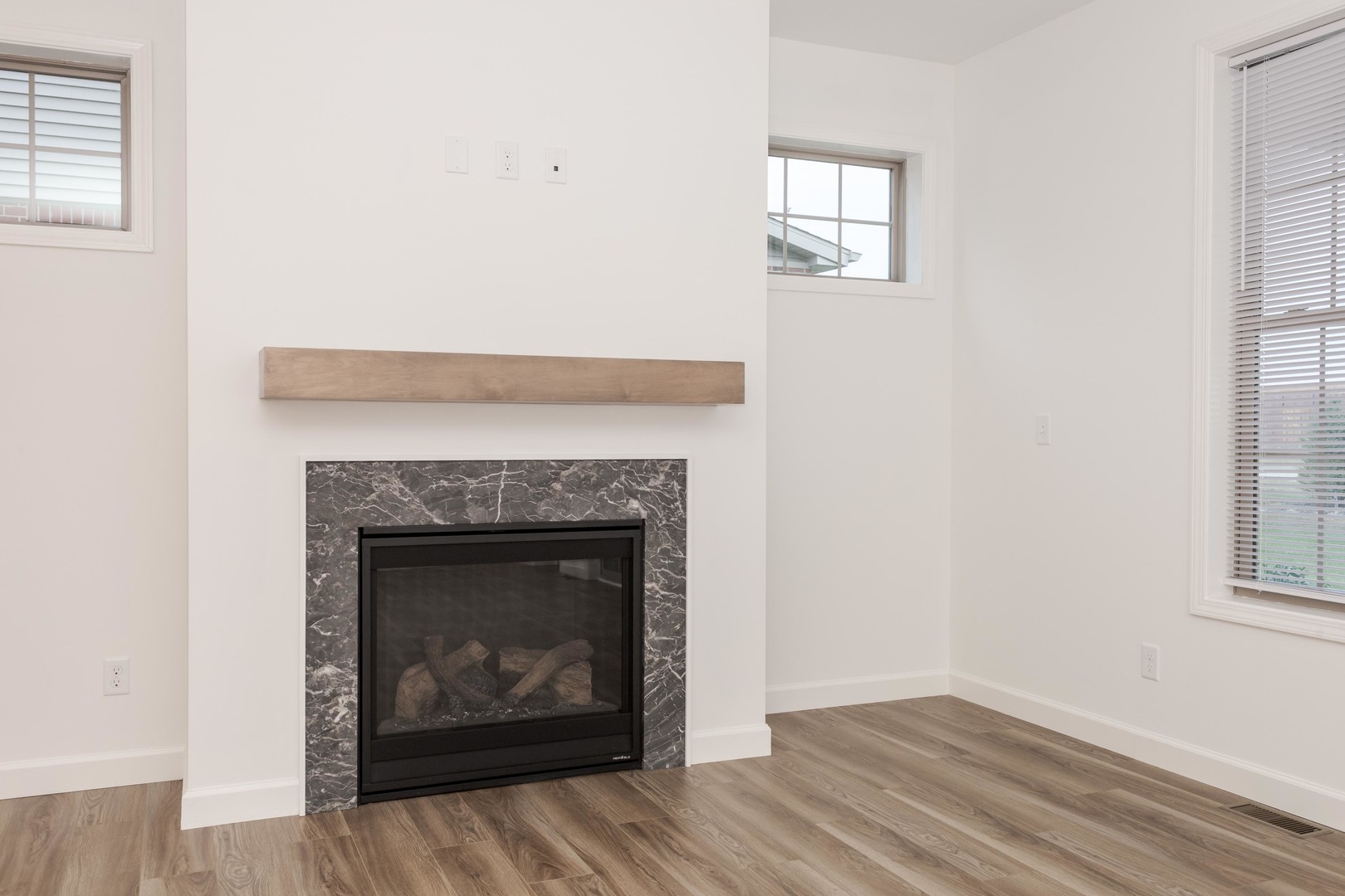 1334 Monterey Pine Drive, Unit 1334 Normal, IL 61761 - Photo 28 of 51 a living room with a fireplace