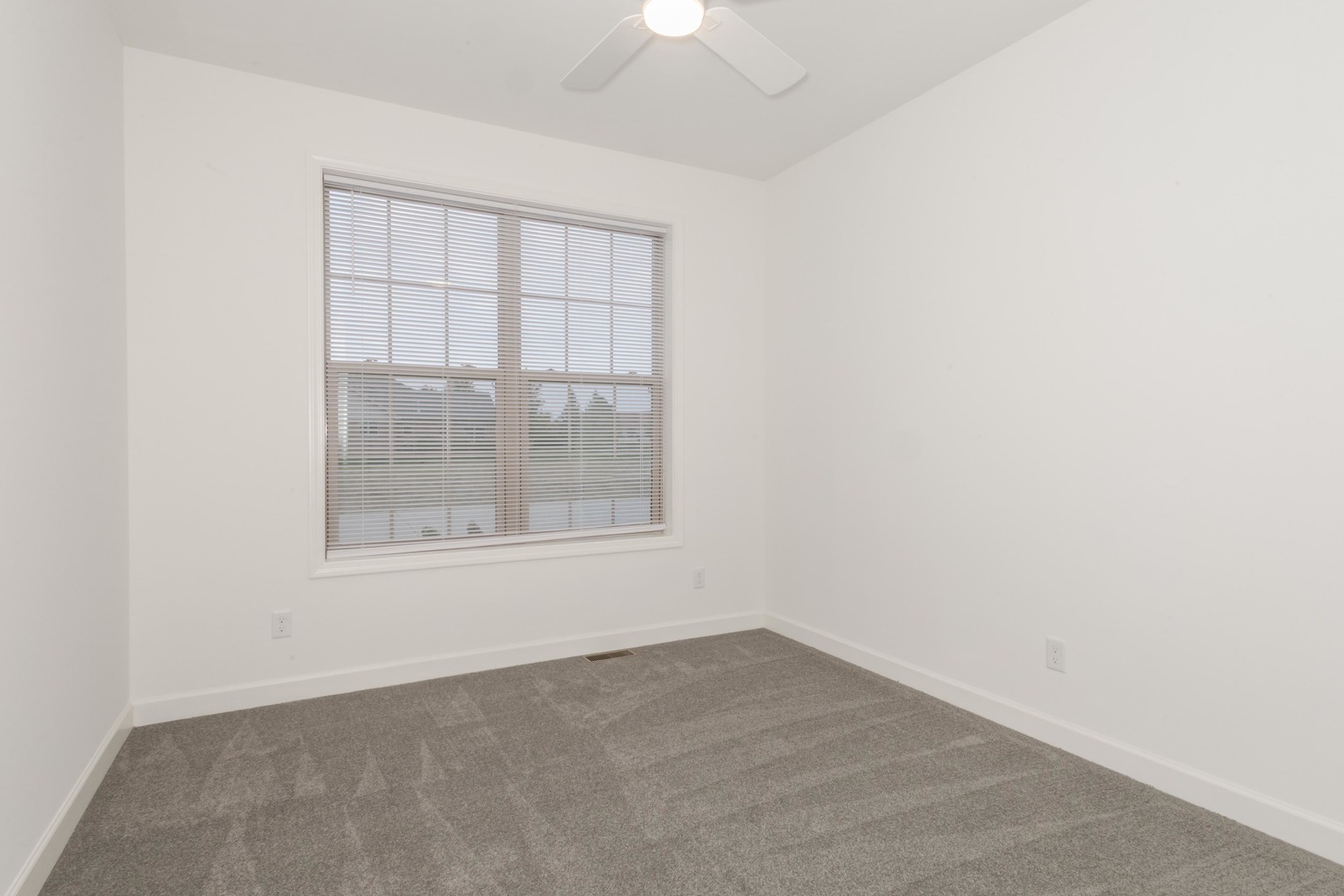 1334 Monterey Pine Drive, Unit 1334 Normal, IL 61761 - Photo 29 of 51 an empty room with a window