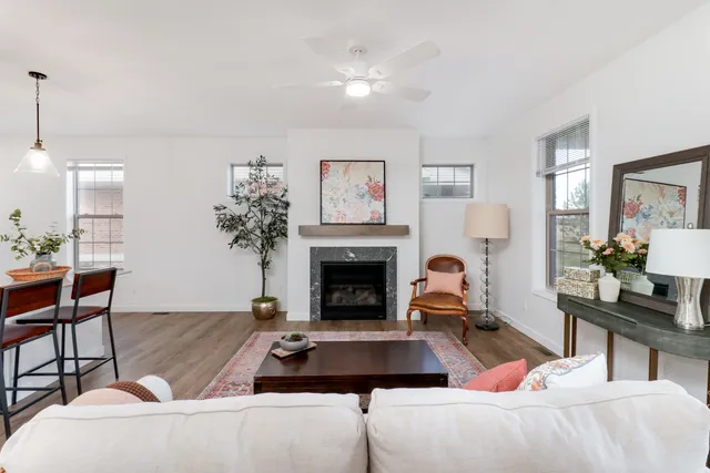 a bedroom with furniture and a fireplace