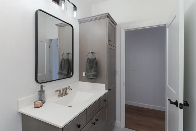 a bathroom with a sink and a mirror