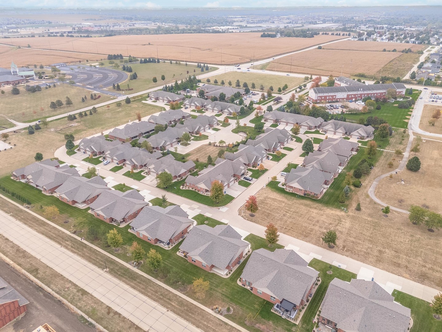 1334 Monterey Pine Drive, Unit 1334 Normal, IL 61761 - Photo 6 of 51 an aerial view of a city
