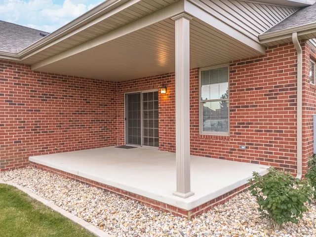 a view of house with backyard