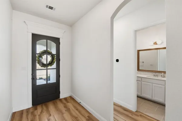 a view of a hallway with washer and dryer