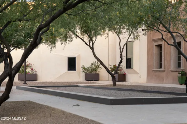 a view of a house with a tree