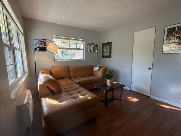 a living room with furniture and a window