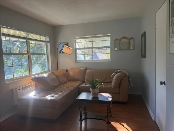 a living room with furniture and a window