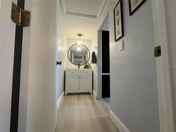 a view of a hallway with washer and dryer