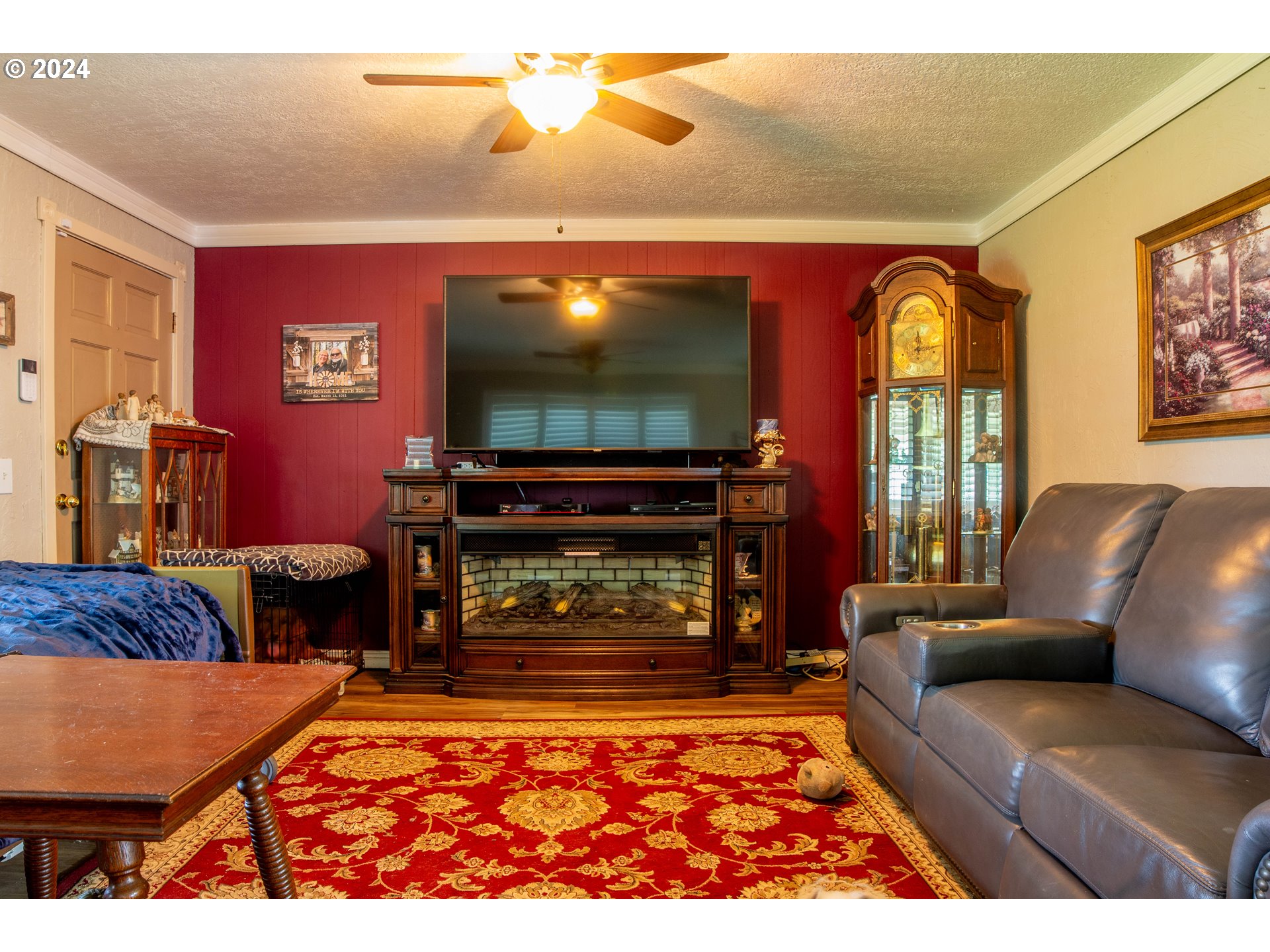 35067 Ede Road Lebanon, OR 97355 - Photo 4 of 40 a living room with furniture a flat screen tv and a fireplace