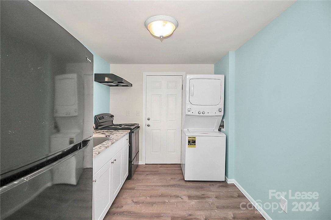 217 Sanders Street, Unit A Fort Mill, SC 29715 - Photo 11 of 16 a kitchen with a refrigerator and a stove