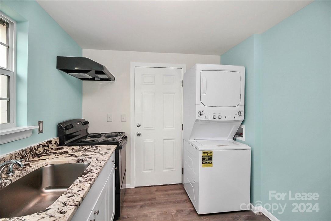 217 Sanders Street, Unit A Fort Mill, SC 29715 - Photo 7 of 16 a kitchen with a sink and a stove top oven