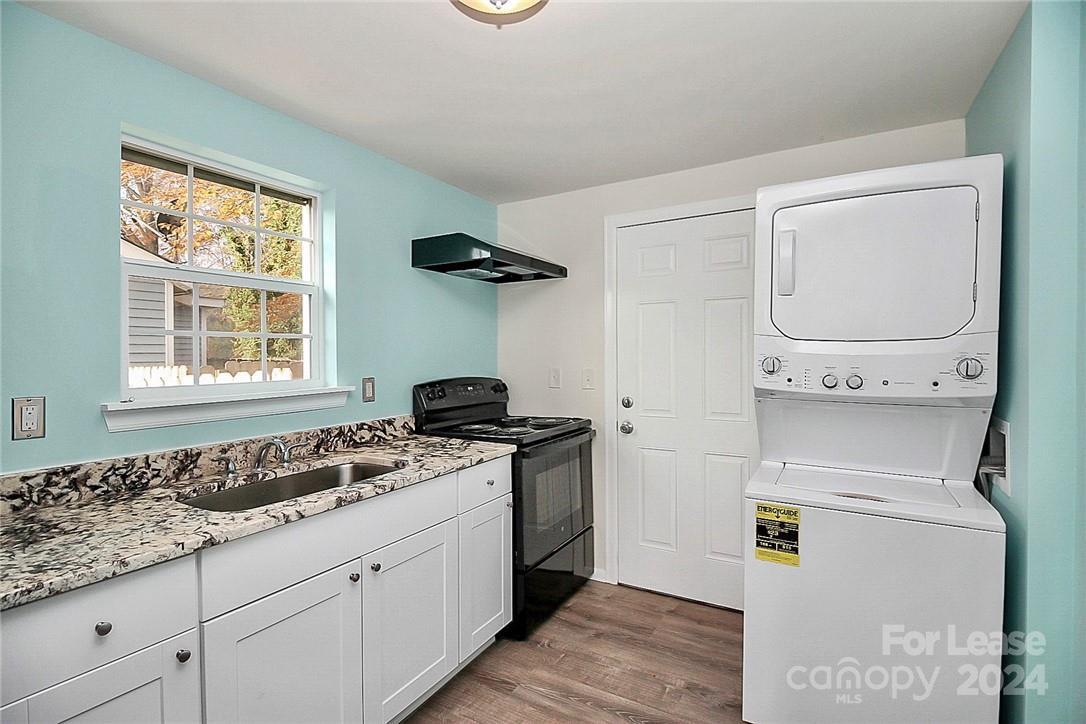 217 Sanders Street, Unit A Fort Mill, SC 29715 - Photo 9 of 16 a kitchen with a stove and a granite counter tops