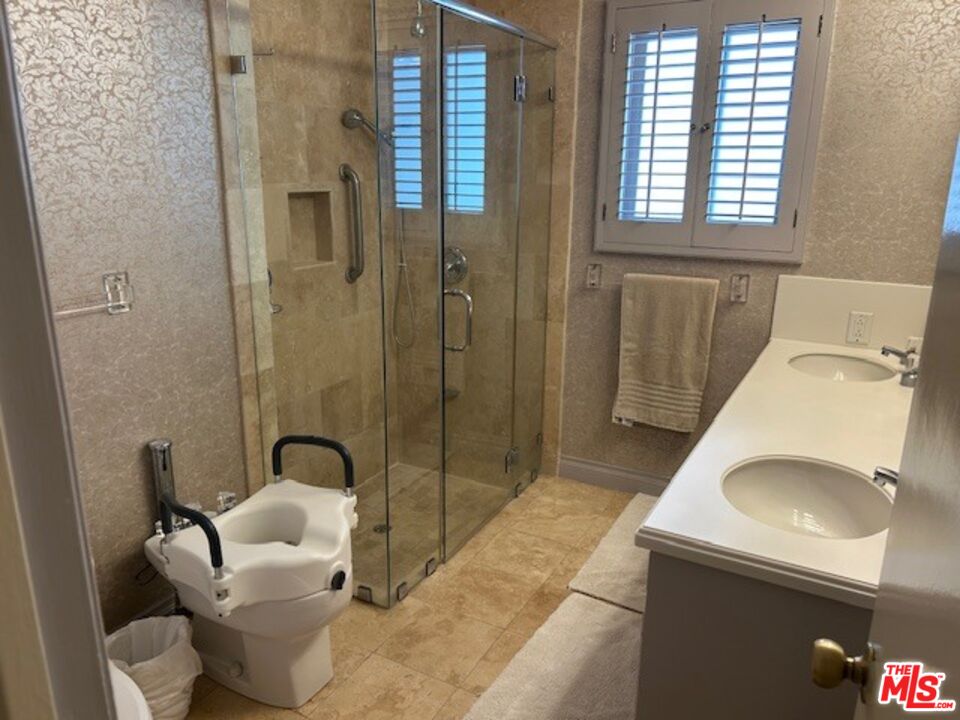 3908 Castlerock Road Malibu, CA 90265 - Photo 14 of 17 a bathroom with a sink toilet and shower