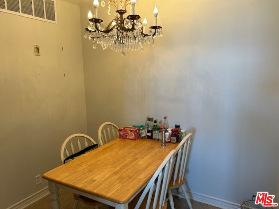 3908 Castlerock Road Malibu, CA 90265 - Photo 6 of 17 a table with chairs and a table