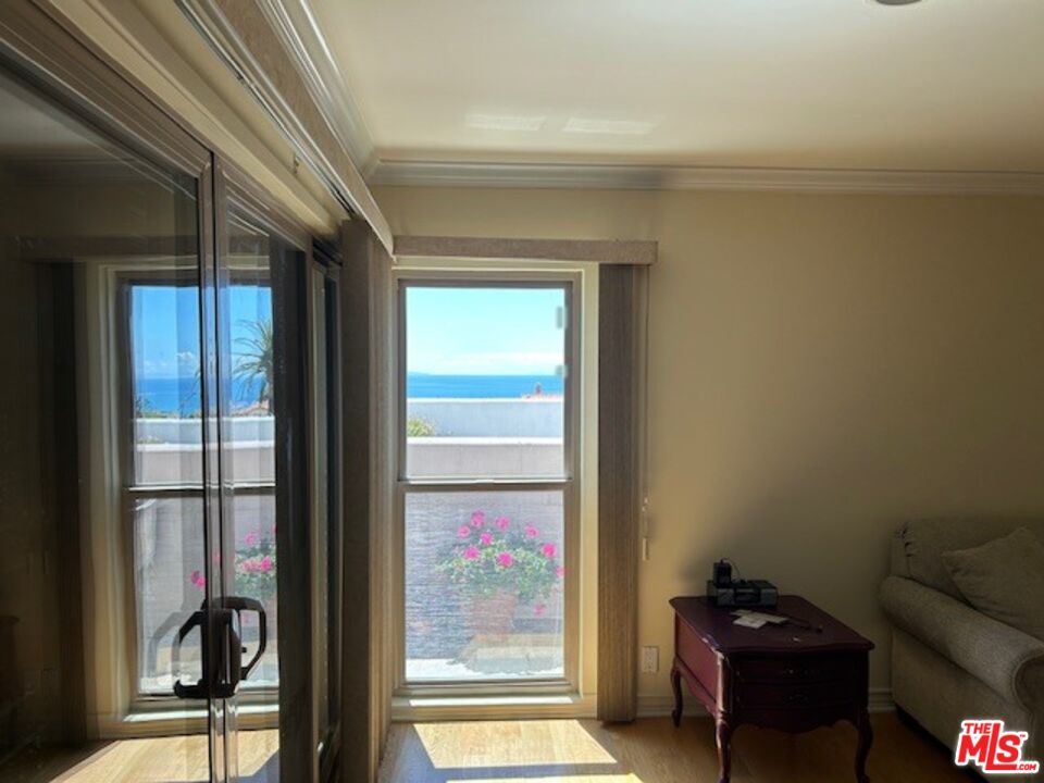3908 Castlerock Road Malibu, CA 90265 - Photo 10 of 17 a living room with furniture and a window