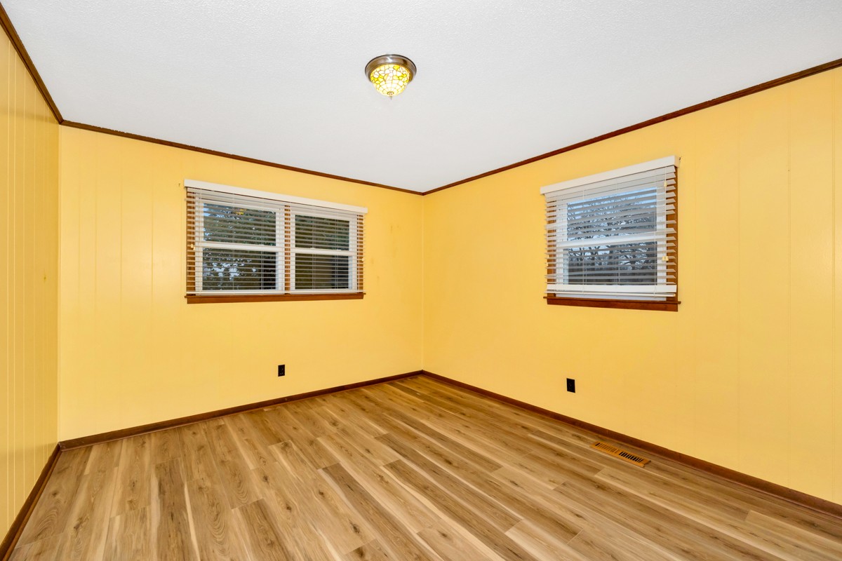 14052 Elk River Mills Road Athens, AL 35614 - Photo 15 of 43 a view of a room with wooden floor and a window