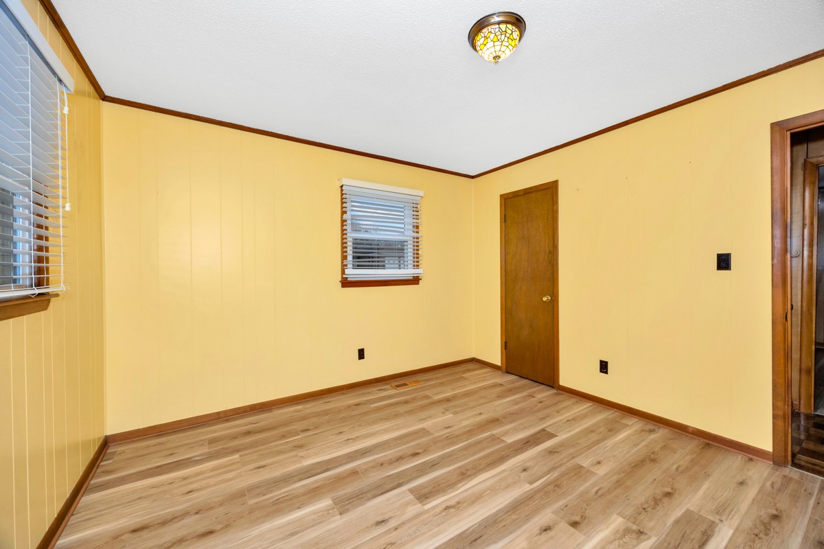 14052 Elk River Mills Road Athens, AL 35614 - Photo 16 of 43 a view of room with wooden floor