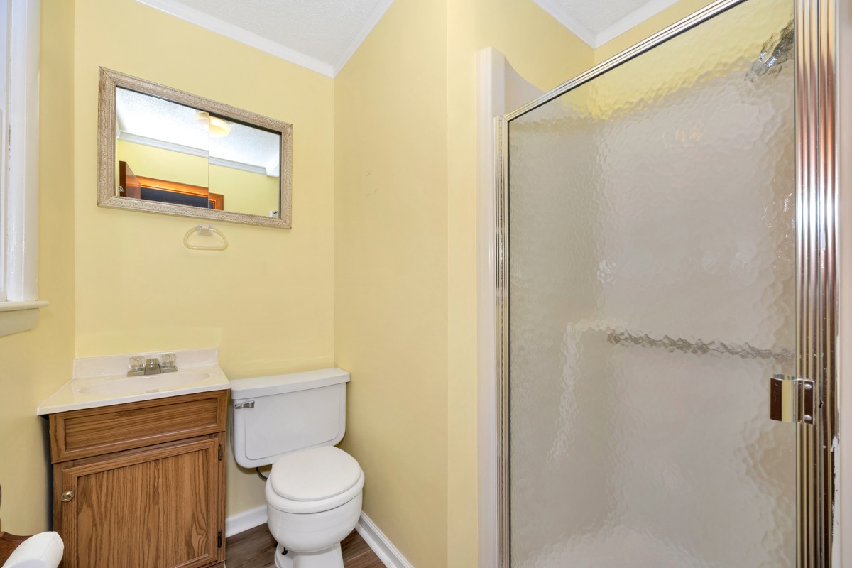 14052 Elk River Mills Road Athens, AL 35614 - Photo 19 of 43 a bathroom with a toilet and a shower