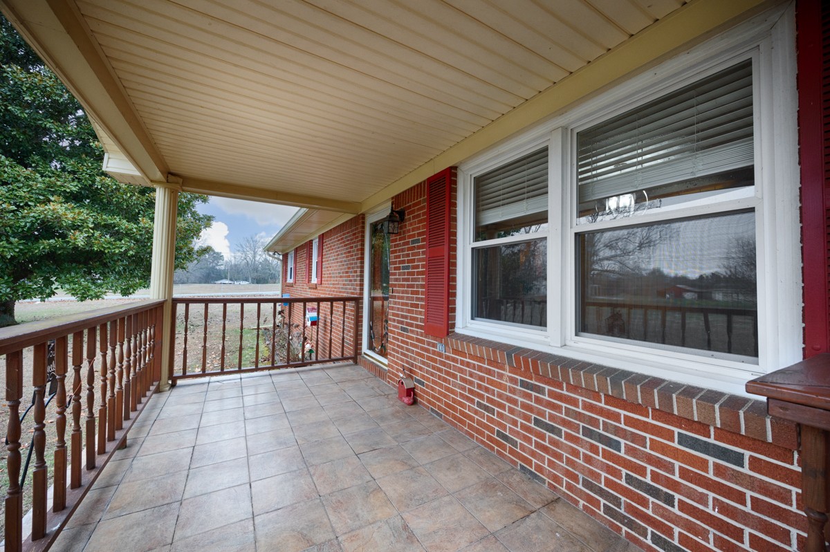 14052 Elk River Mills Road Athens, AL 35614 - Photo 2 of 43 a view of a brick house with a large window