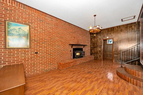 a view of a livingroom with furniture and a fireplace