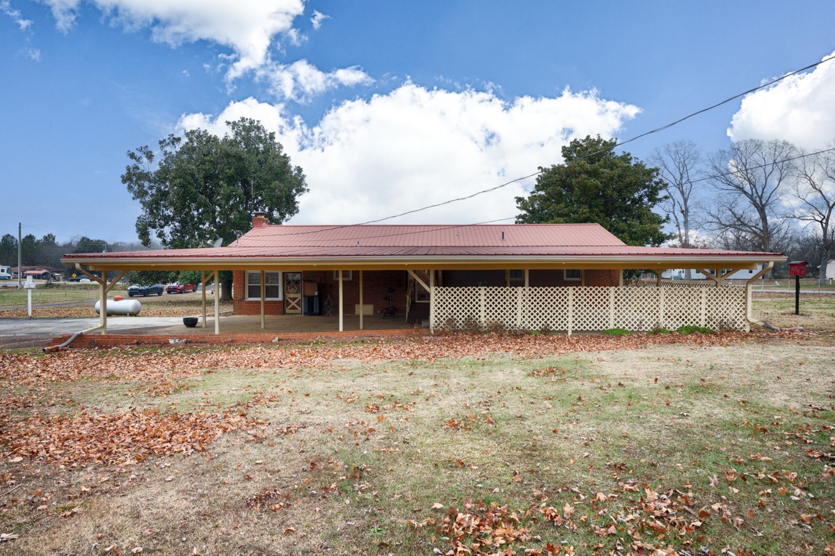 14052 Elk River Mills Road Athens, AL 35614 - Photo 32 of 43 a front view of a house with a garden