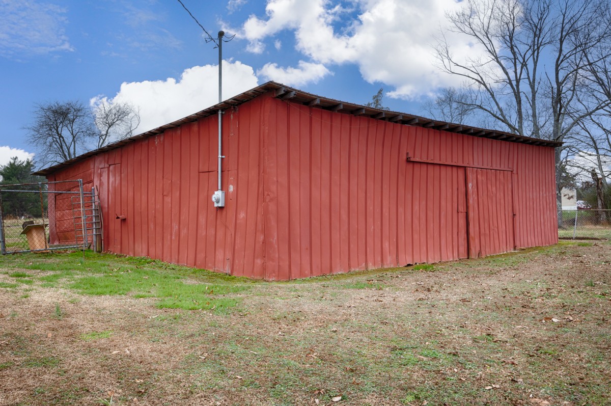 14052 Elk River Mills Road Athens, AL 35614 - Photo 35 of 43 a view of a backyard with wooden fence