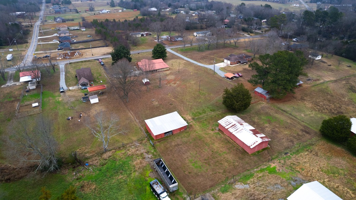 14052 Elk River Mills Road Athens, AL 35614 - Photo 43 of 43 a backyard of a house with table and chairs