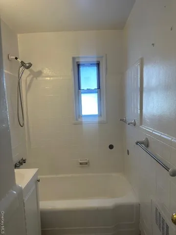a bathroom with a bathtub