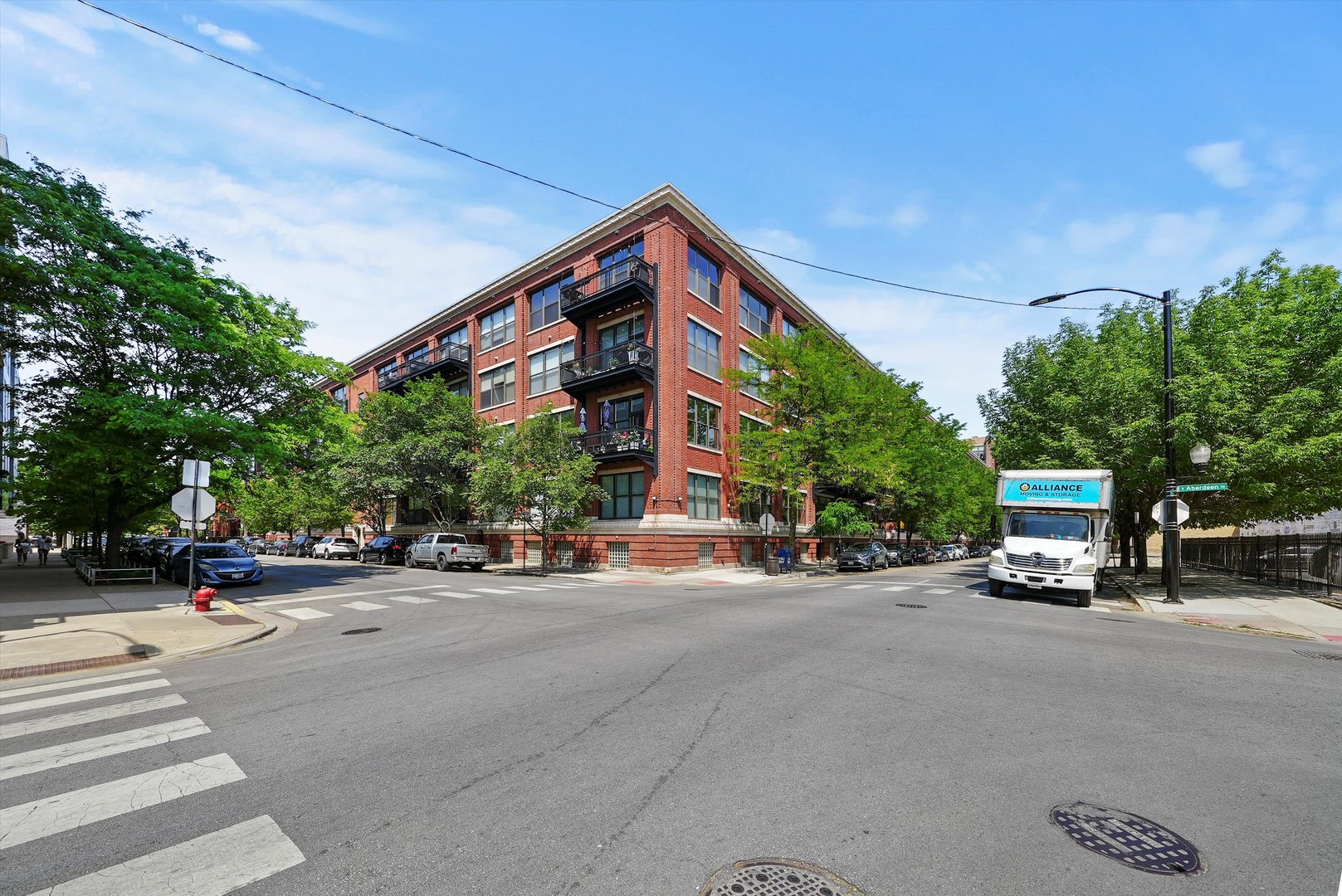 a view of a street with cars