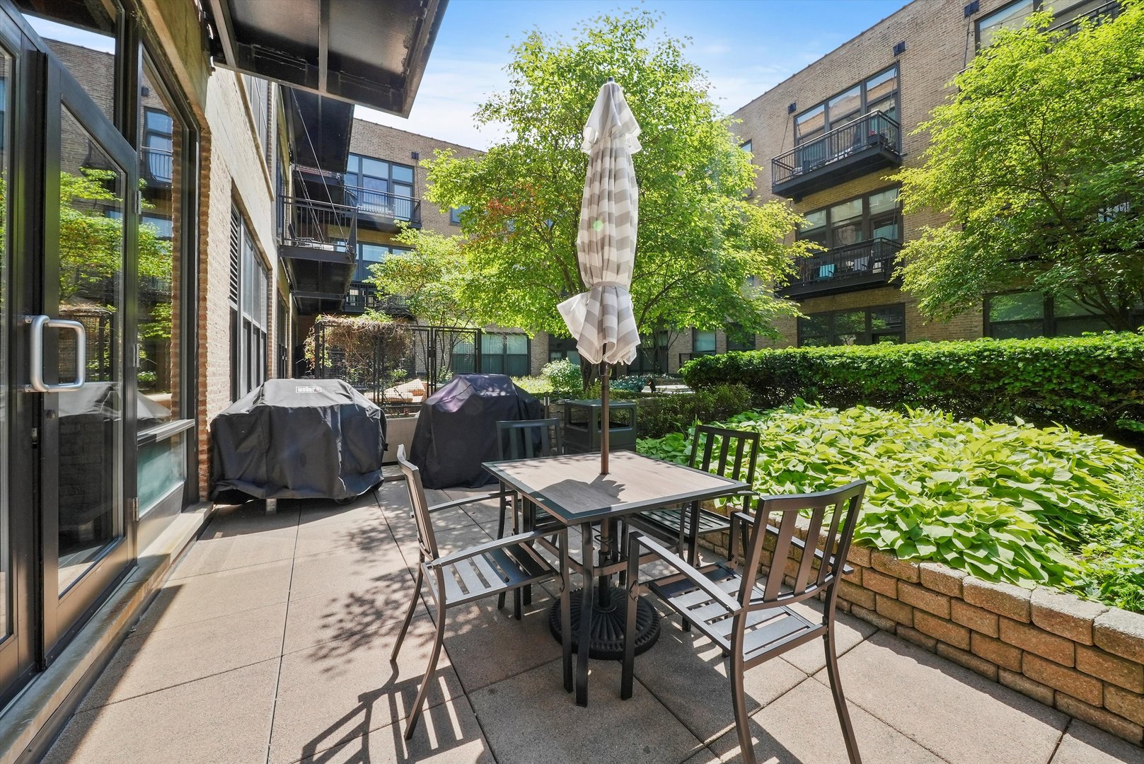 1040 West Adams Street, Unit 213 Chicago, IL 60607 - Photo 14 of 30 a view of outdoor dining space with a patio