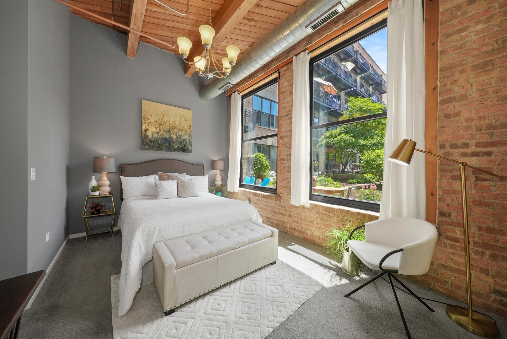 1040 West Adams Street, Unit 213 Chicago, IL 60607 - Photo 16 of 30 a bedroom with a bed and a window