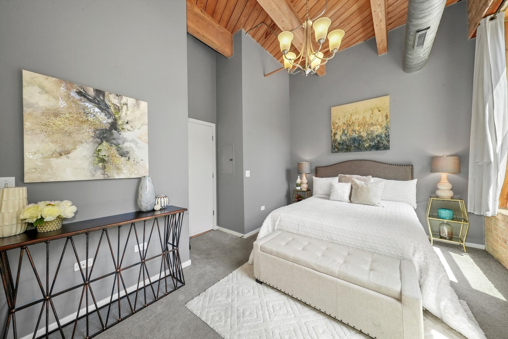 1040 West Adams Street, Unit 213 Chicago, IL 60607 - Photo 17 of 30 a bedroom with a bed and a painting on the wall