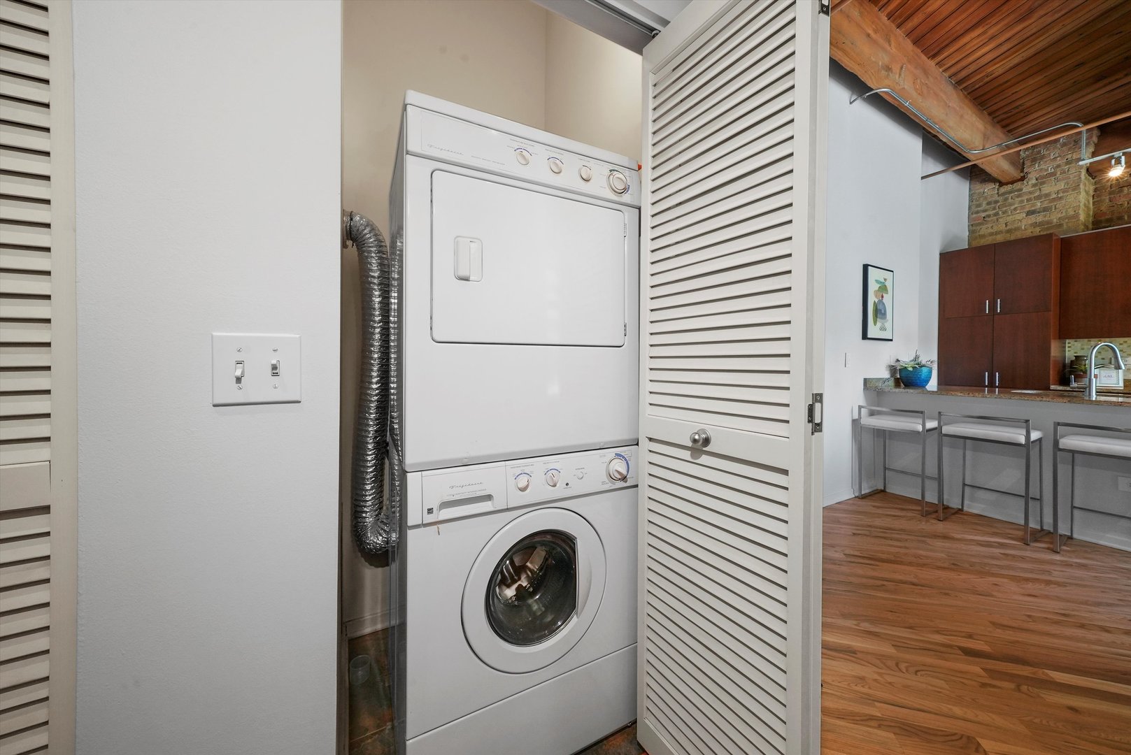 1040 West Adams Street, Unit 213 Chicago, IL 60607 - Photo 20 of 30 a utility room with dryer and washer