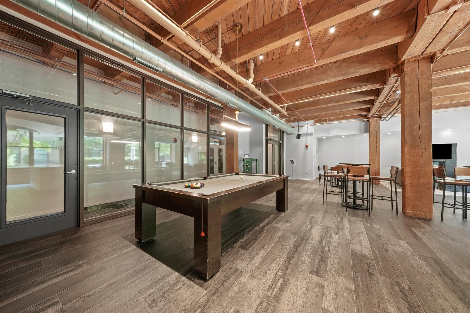 1040 West Adams Street, Unit 213 Chicago, IL 60607 - Photo 23 of 30 a room with table and chairs