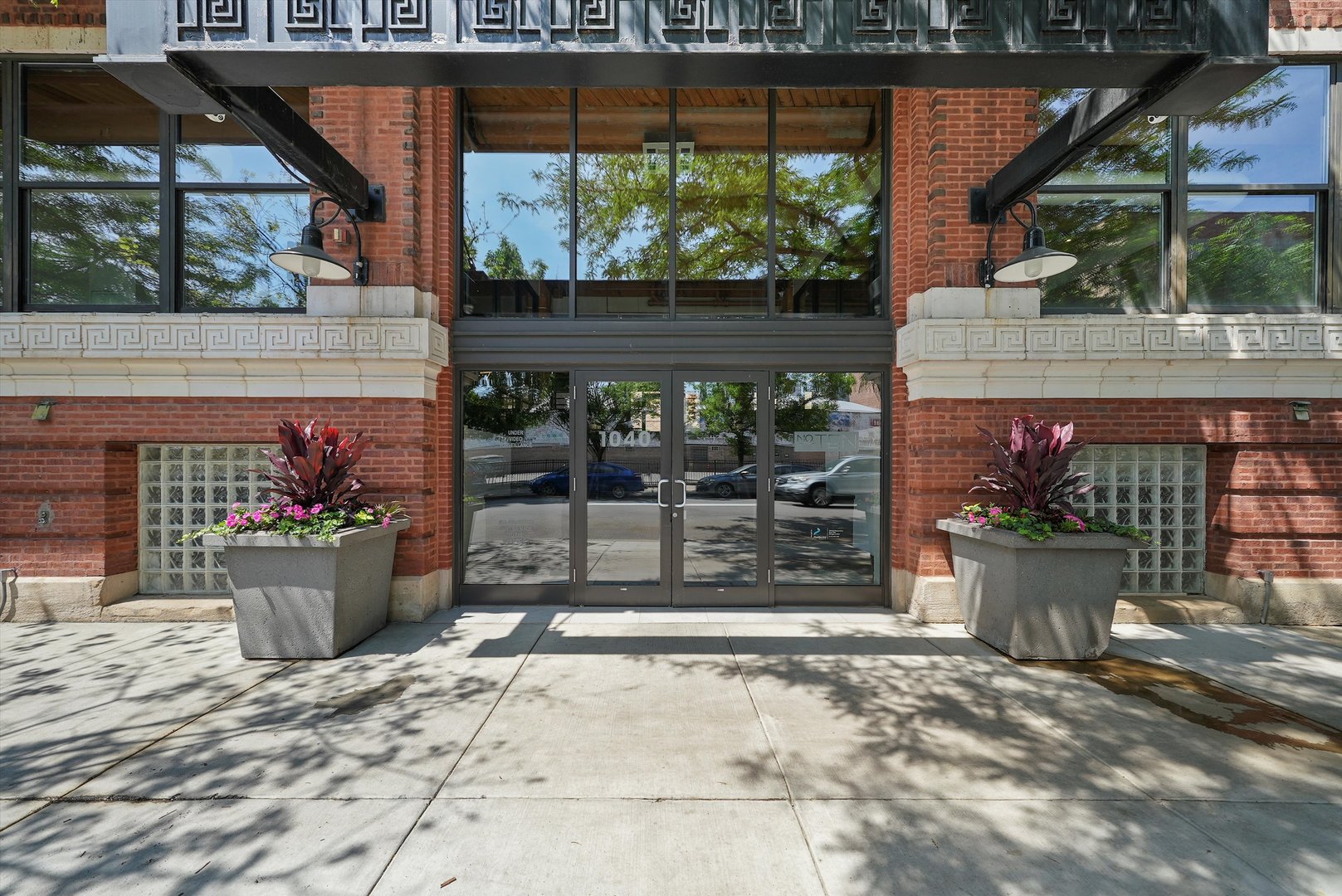 1040 West Adams Street, Unit 213 Chicago, IL 60607 - Photo 29 of 30 a view of a patio with table and chairs potted plants