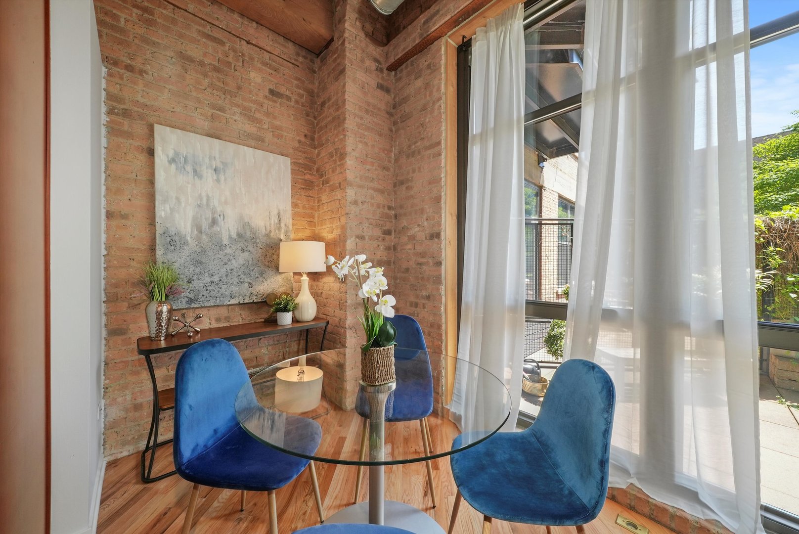1040 West Adams Street, Unit 213 Chicago, IL 60607 - Photo 5 of 30 a dining room with furniture and wooden floor