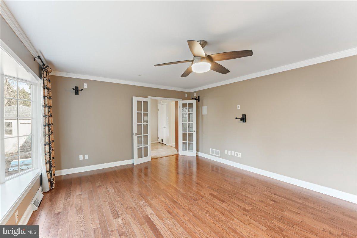 97 Quail Run Kennett Square, PA 19348 - Photo 15 of 34 an empty room with wooden floor and windows