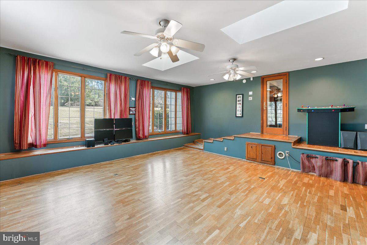 97 Quail Run Kennett Square, PA 19348 - Photo 19 of 34 a bedroom with a bed and a chandelier