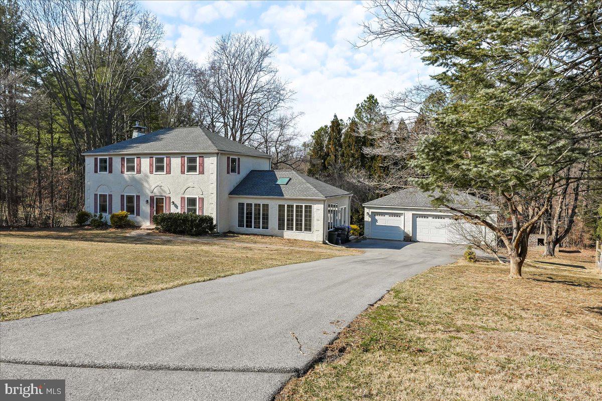 97 Quail Run Kennett Square, PA 19348 - Photo 2 of 34 a front view of a house with a yard covered with snow