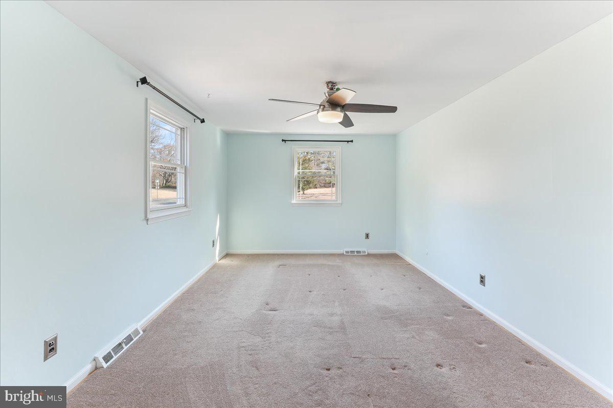 97 Quail Run Kennett Square, PA 19348 - Photo 22 of 34 an empty room with windows and fan