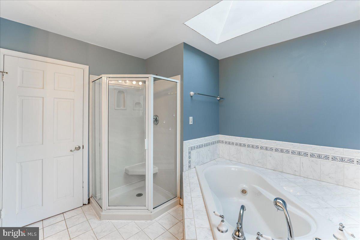 97 Quail Run Kennett Square, PA 19348 - Photo 26 of 34 a bathroom with a bathtub and shower