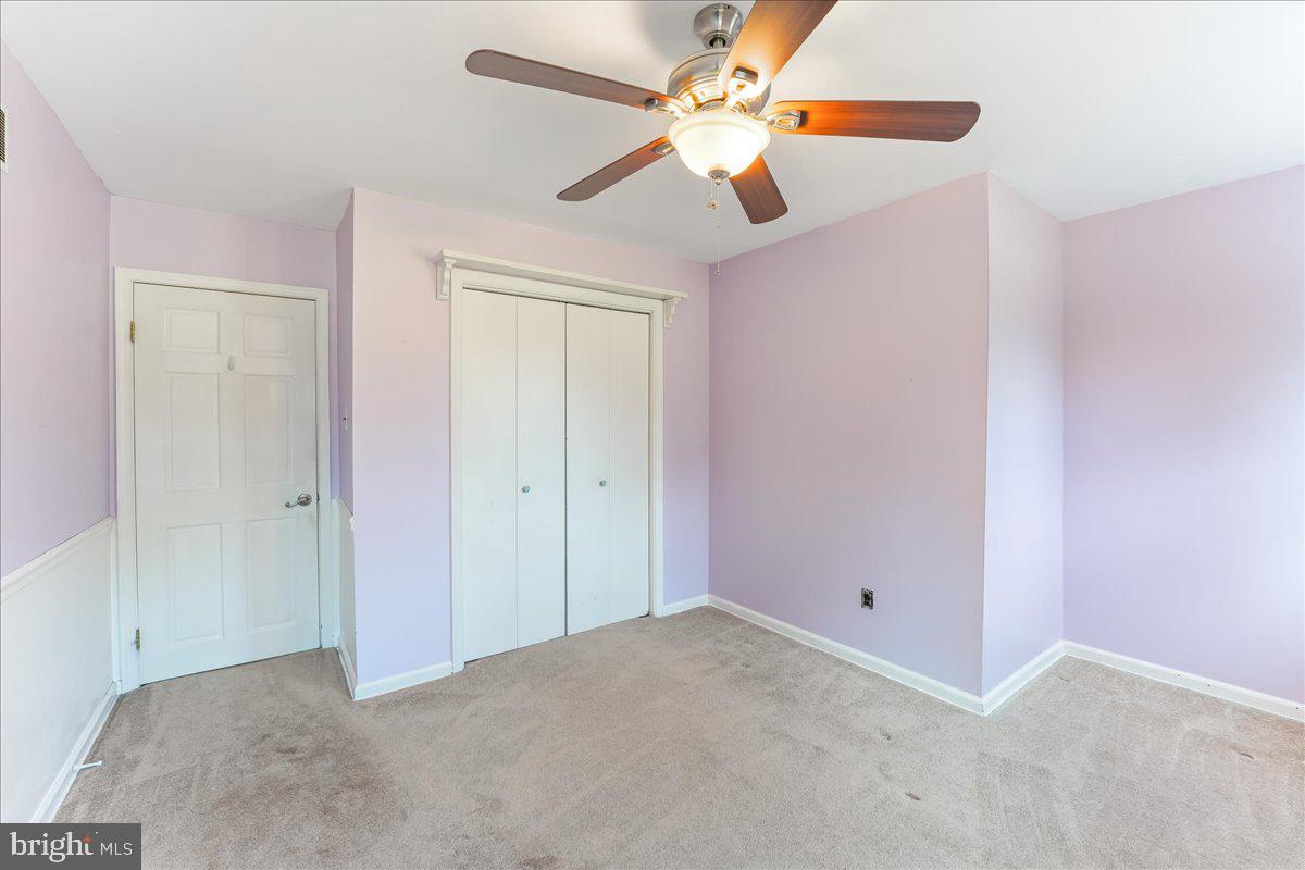 97 Quail Run Kennett Square, PA 19348 - Photo 29 of 34 an empty room with closet and fan