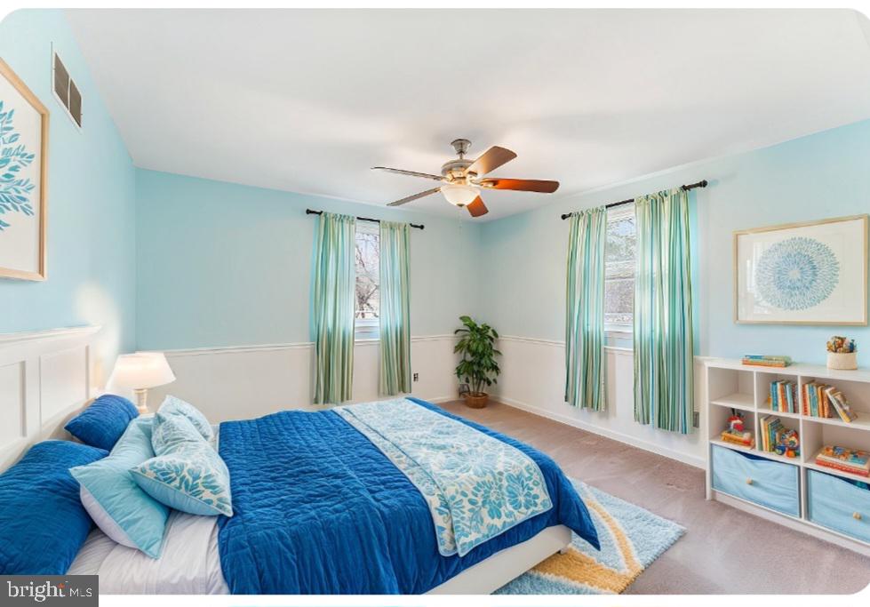 97 Quail Run Kennett Square, PA 19348 - Photo 30 of 34 a bedroom with a bed and a chandelier