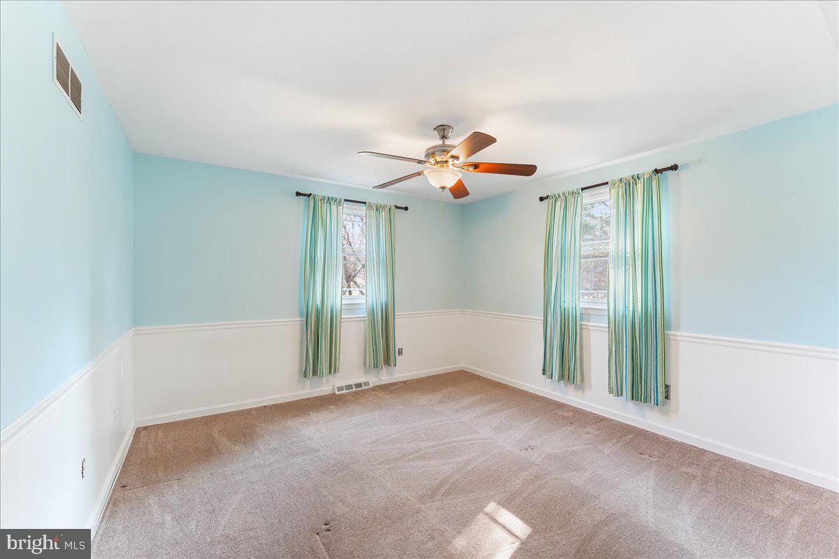 97 Quail Run Kennett Square, PA 19348 - Photo 31 of 34 a view of a livingroom with a chandelier fan and windows