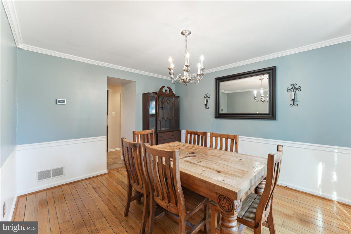 97 Quail Run Kennett Square, PA 19348 - Photo 8 of 34 a view of a dining room with furniture and wooden floor