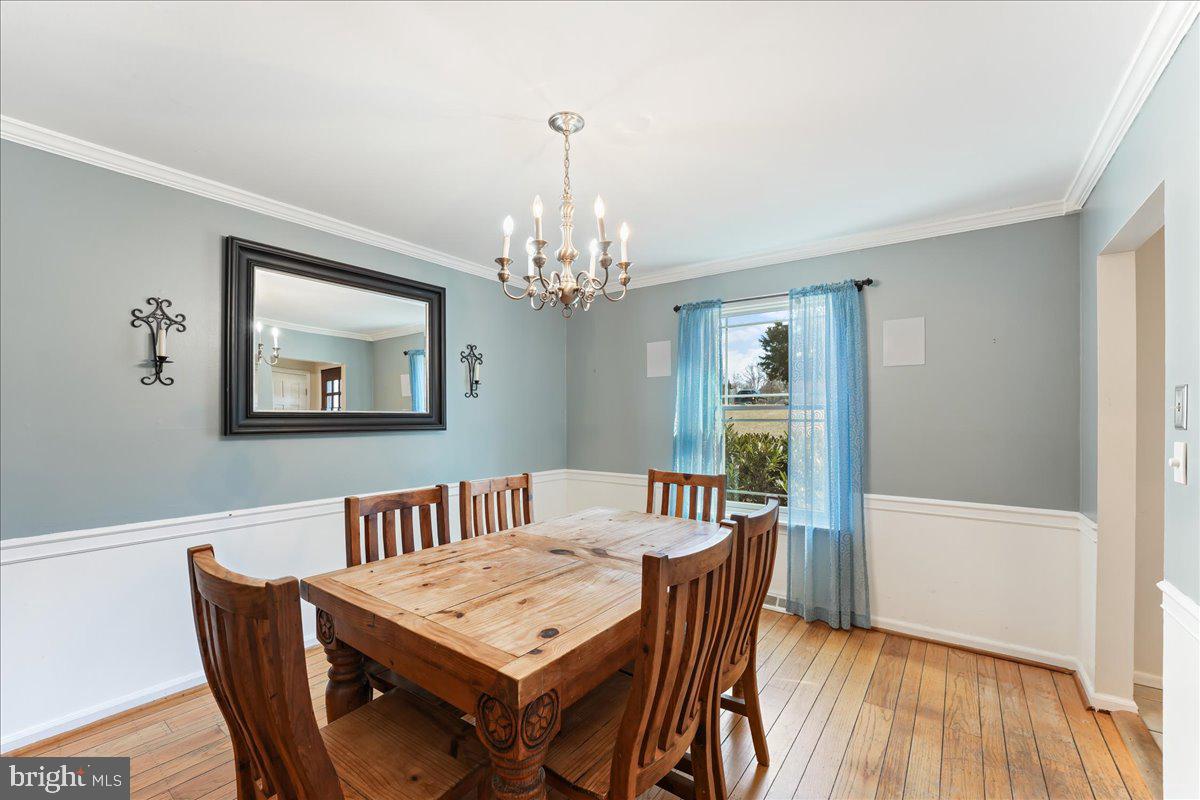 97 Quail Run Kennett Square, PA 19348 - Photo 9 of 34 a view of a dining room with furniture window and wooden floor