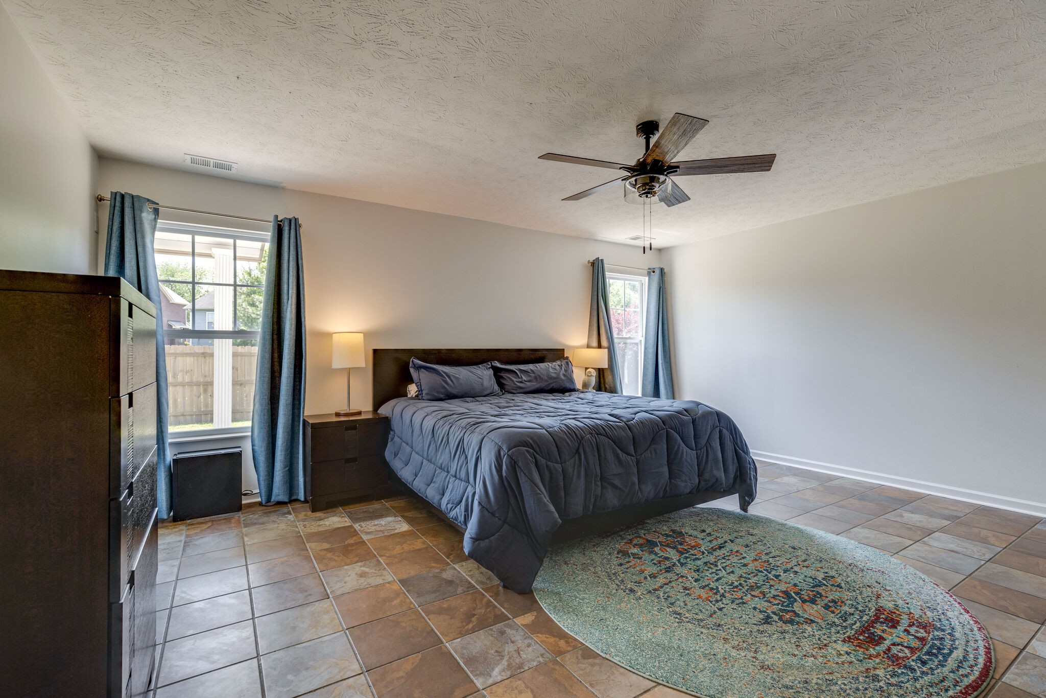 3981 Stephens Ridge Way Antioch, TN 37013 - Photo 18 of 31 a bedroom with a bed and a chandelier