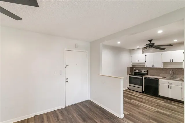 a view of kitchen with wooden floor