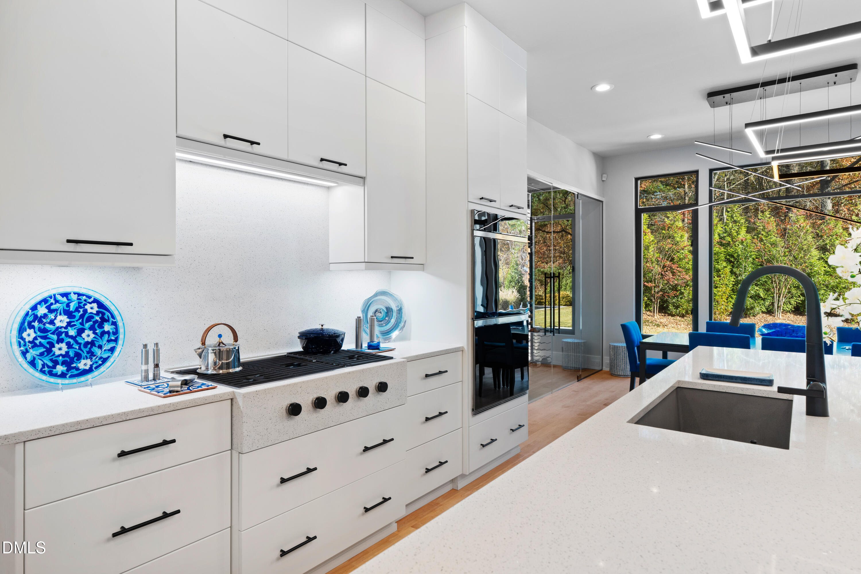132 Edward Booth Lane Durham, NC 27713 - Photo 15 of 75 a kitchen with granite countertop a stove a sink and a refrigerator