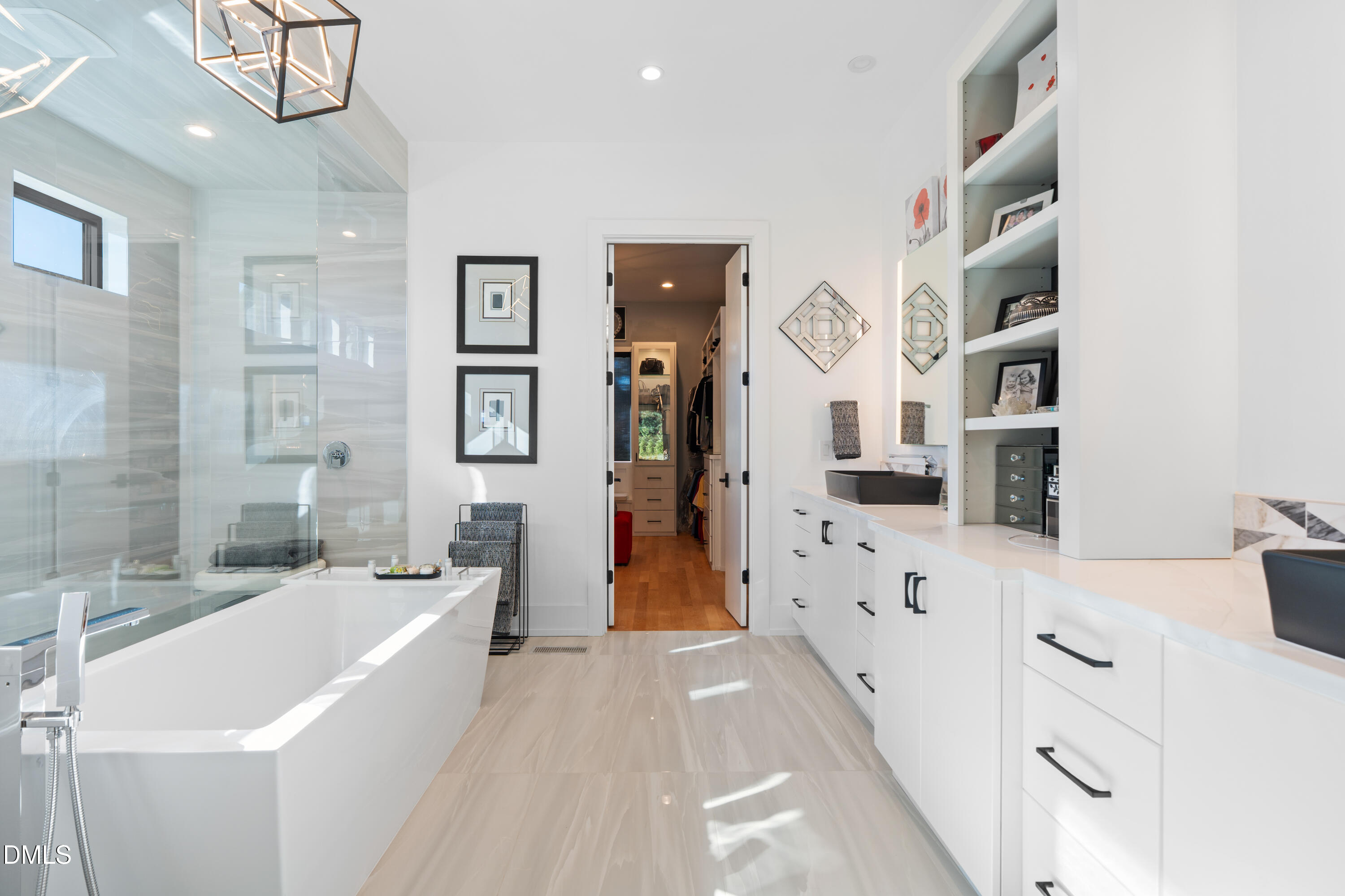 132 Edward Booth Lane Durham, NC 27713 - Photo 28 of 75 a bathroom with a bathtub a sink and a large mirror